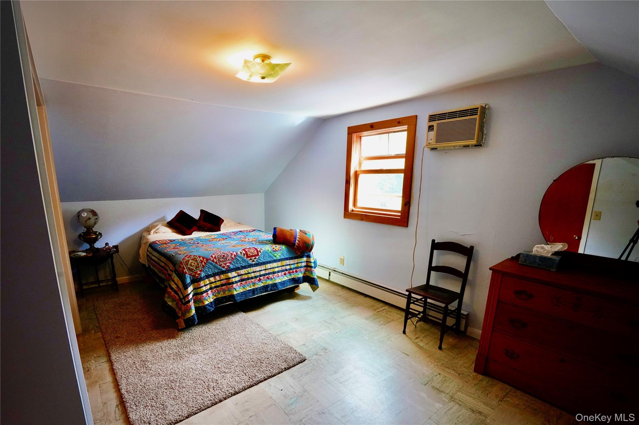 669 Shandelee Road Livingston Manor, NY 12758 - Photo 31 of 46 a bedroom with a bed and a chair