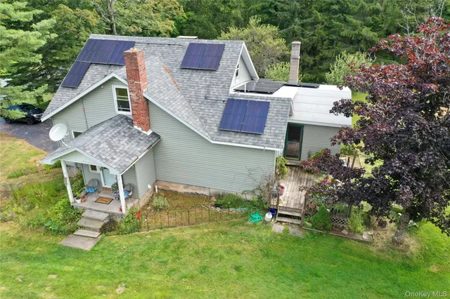 an aerial view of a house with a garden and plants