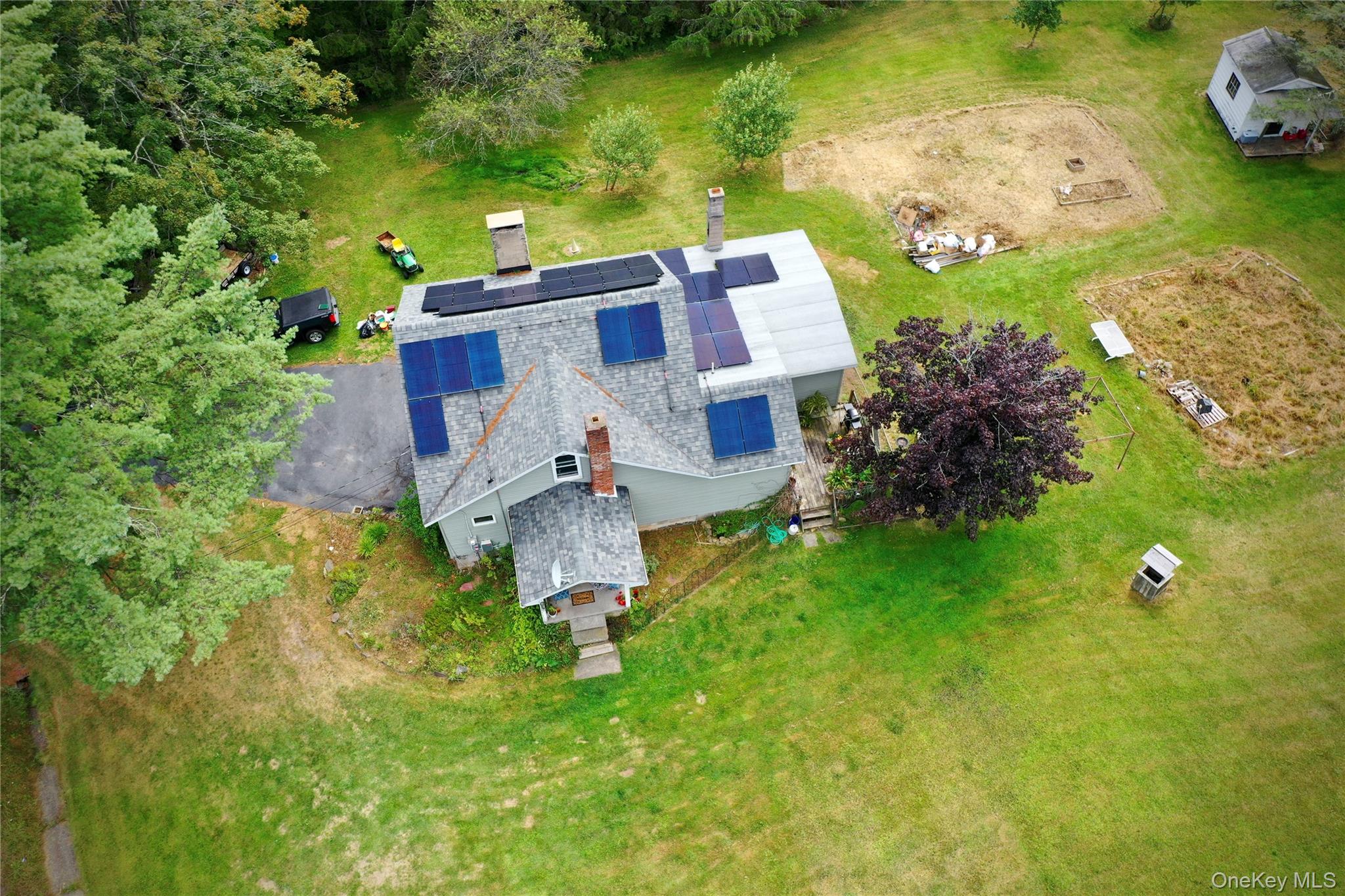 669 Shandelee Road Livingston Manor, NY 12758 - Photo 6 of 46 an aerial view of a house with a yard basket ball court and outdoor seating