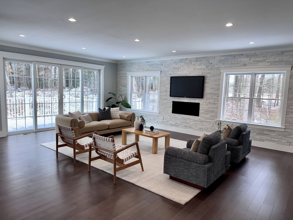 4 Kerri Lane Whitman, MA 02382 - Photo 7 of 24 a living room with furniture and a flat screen tv