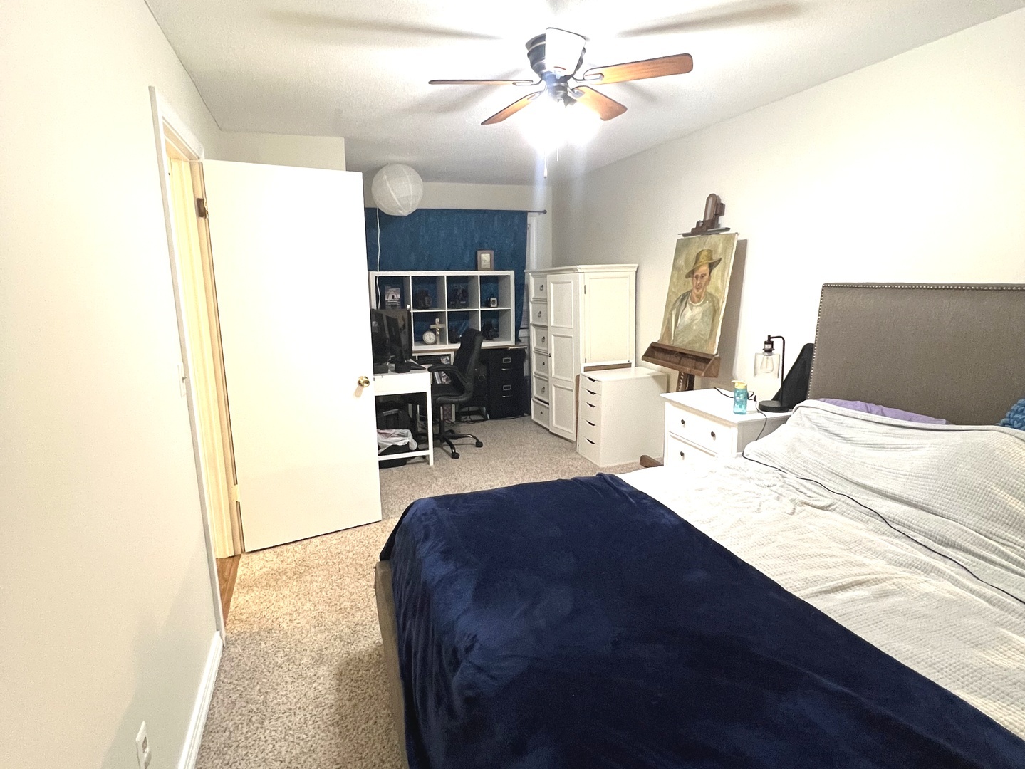 106 Spring Circle, Unit 106 Urbana, IL 61802 - Photo 16 of 18 a bedroom with a bed and a chandelier