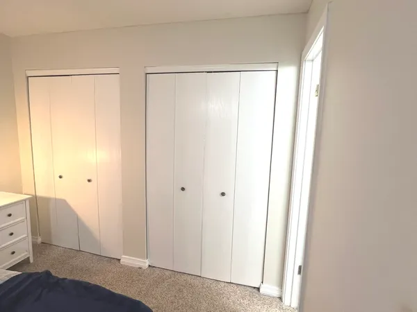 a bathroom with a granite countertop shower sink and toilet