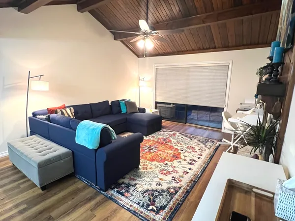 a living room with furniture and a rug