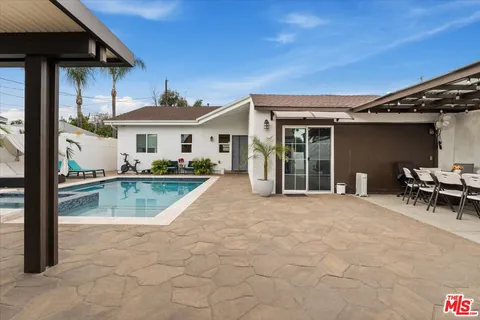 a view of swimming pool with lounge chair