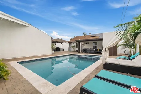 a view of a living room and bathroom