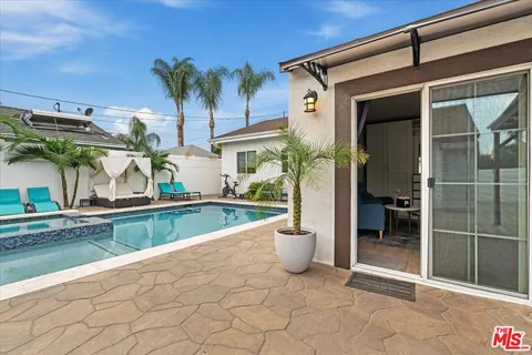 a bedroom with a bed and a table in it