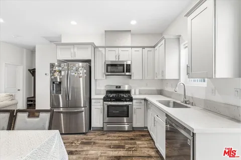 a bedroom with a bed and a table