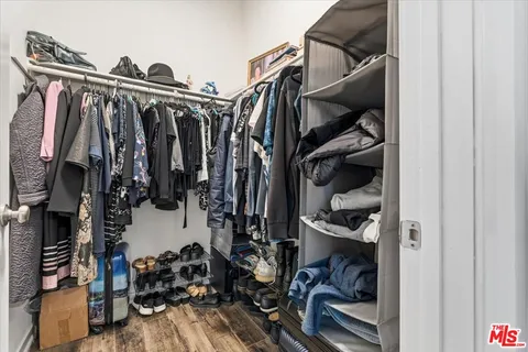 an aerial view of residential houses with outdoor space and parking