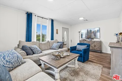 a kitchen with a stove a sink and a refrigerator