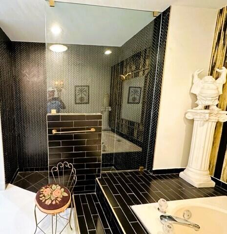 150 Cape Pointe Circle Jupiter, FL 33477 - Photo 12 of 22 a bathroom with a shower