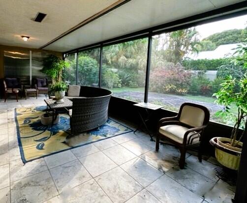 150 Cape Pointe Circle Jupiter, FL 33477 - Photo 20 of 22 a living room with furniture and a large window