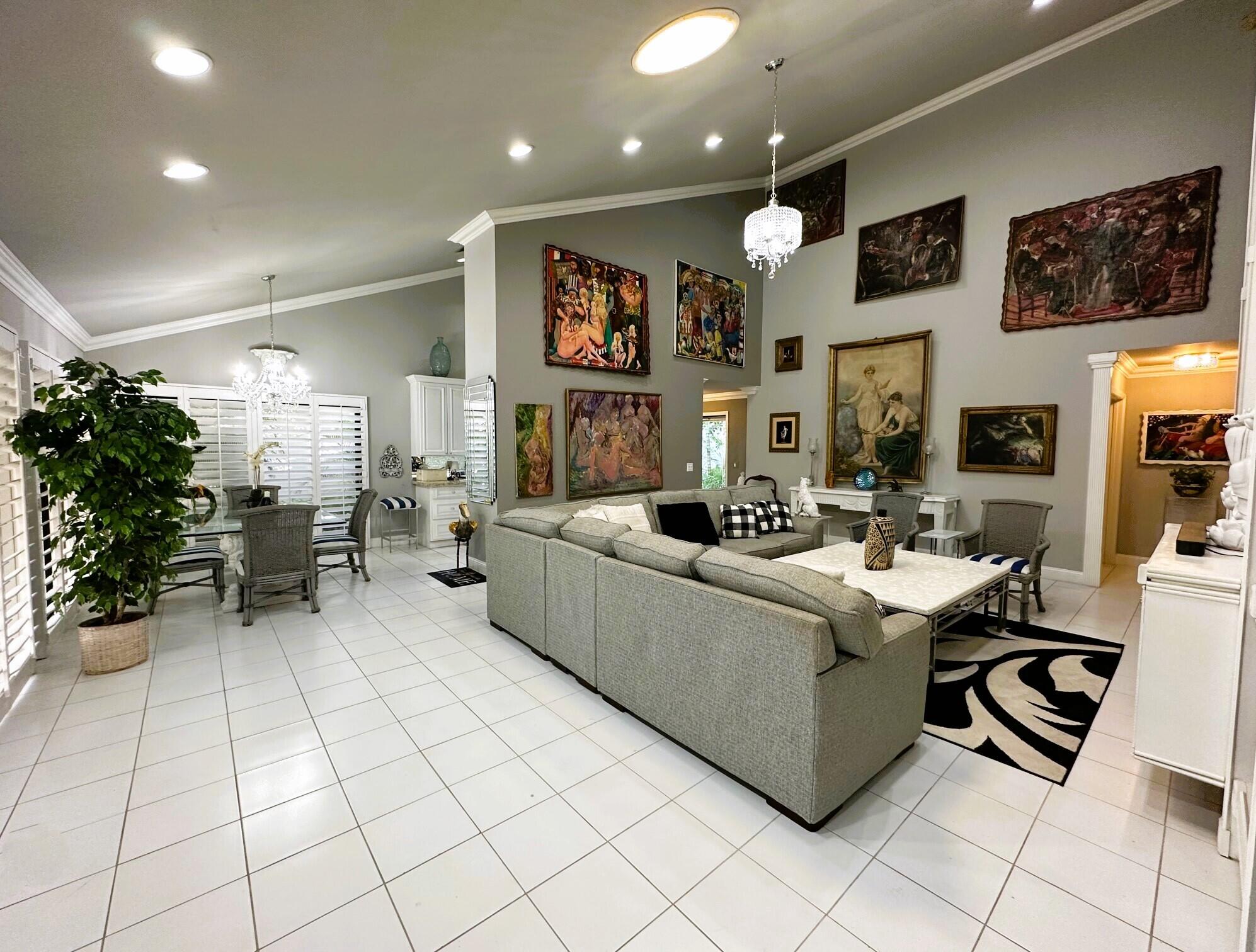 150 Cape Pointe Circle Jupiter, FL 33477 - Photo 2 of 22 a living room with furniture and a flat screen tv