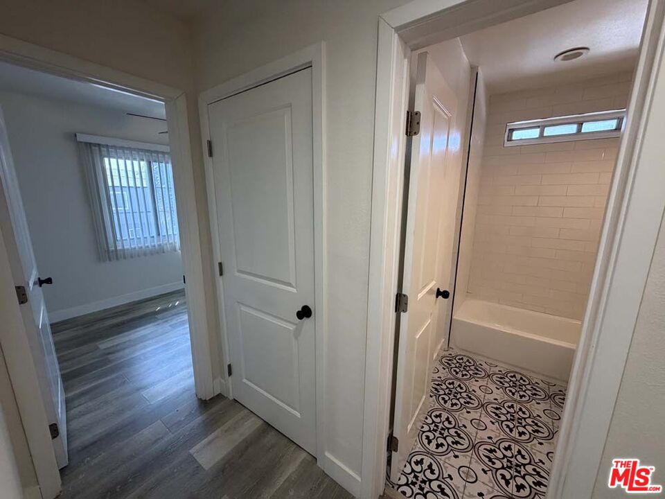 8818 Ramsgate Avenue, Unit 8822 1/2 Los Angeles, CA 90045 - Photo 17 of 20 a view of a hallway with wooden floor and closet area