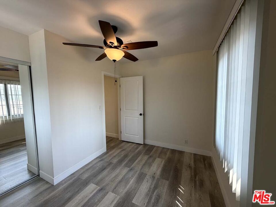 8818 Ramsgate Avenue, Unit 8822 1/2 Los Angeles, CA 90045 - Photo 20 of 20 a view of empty room with wooden floor and fan