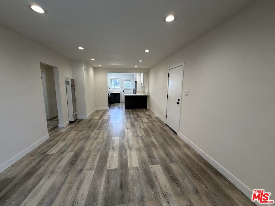8818 Ramsgate Avenue, Unit 8822 1/2 Los Angeles, CA 90045 - Photo 3 of 20 a view of a big room with wooden floor and windows
