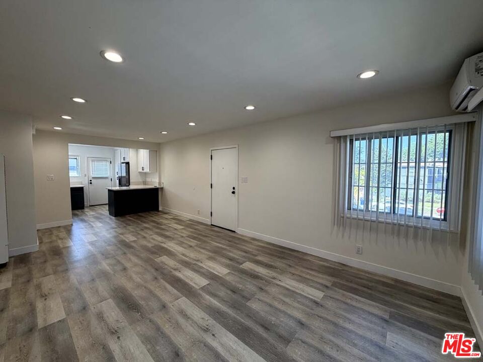 8818 Ramsgate Avenue, Unit 8822 1/2 Los Angeles, CA 90045 - Photo 4 of 20 a view of empty room with kitchen and window