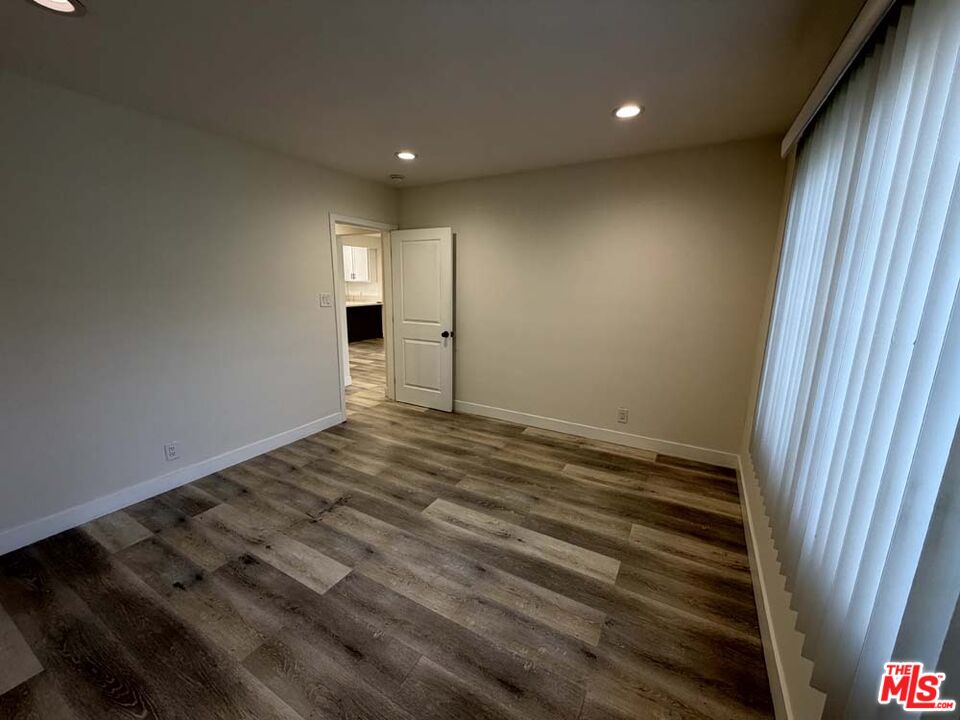 8818 Ramsgate Avenue, Unit 8822 1/2 Los Angeles, CA 90045 - Photo 10 of 20 a view of empty room with wooden floor