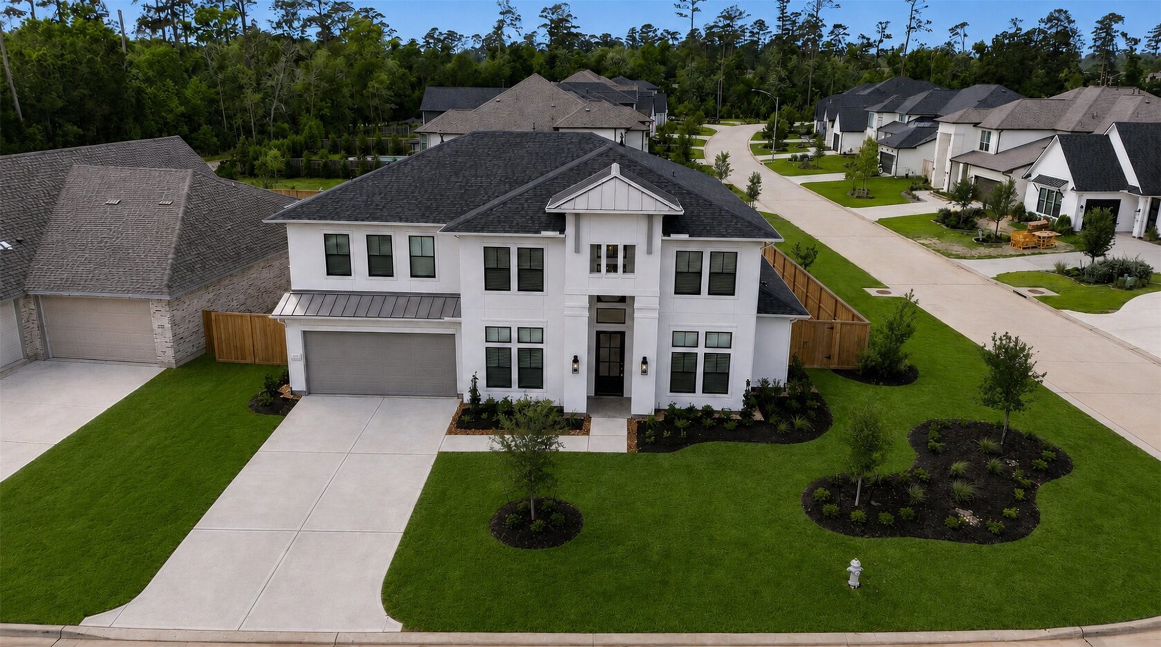 416 Venado View Court Conroe, TX 77304 - Photo 34 of 34 Beautifully designed contemporary residence situated on a spacious homesite with exceptional curb appeal and refined exterior finishes.