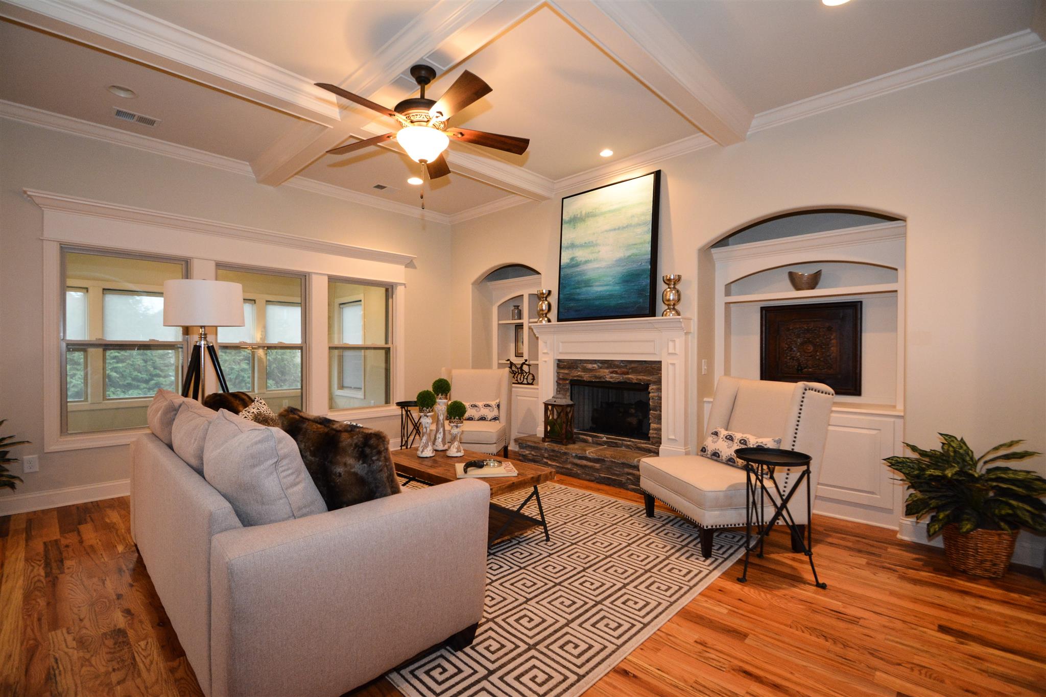 2068 Autumn Ridge Way Spring Hill, TN 37174 - Photo 6 of 29 Lovely family room featuring unique arched built in shelving, coffered ceilings and stone-trimmed fireplace.