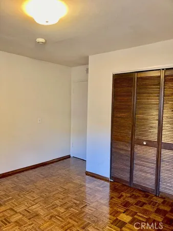 an empty room with a wooden door
