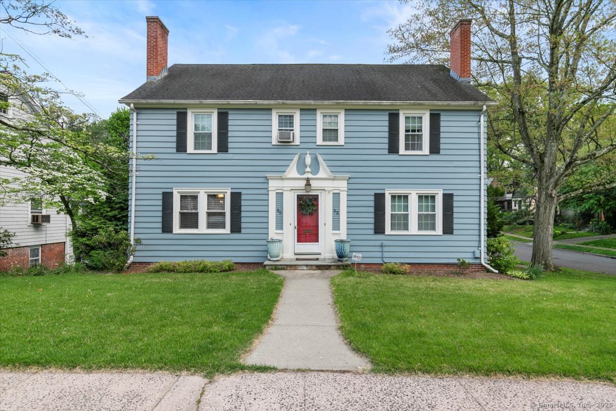 front view of a house with a yard
