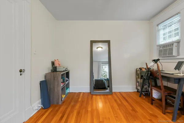 a view of a livingroom with furniture and an empty room