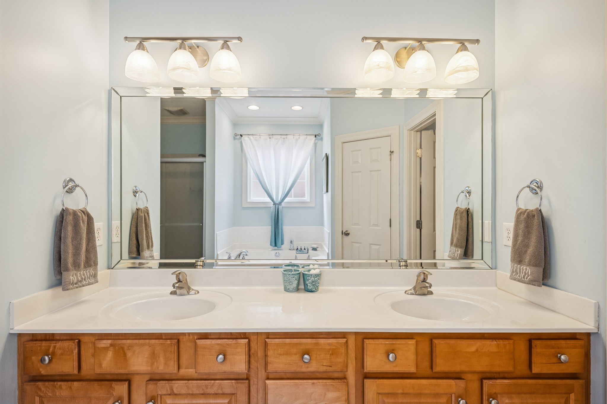 2172 Alexander Boulevard Murfreesboro, TN 37130 - Photo 21 of 46 a bathroom with double vanity sinks and a mirror