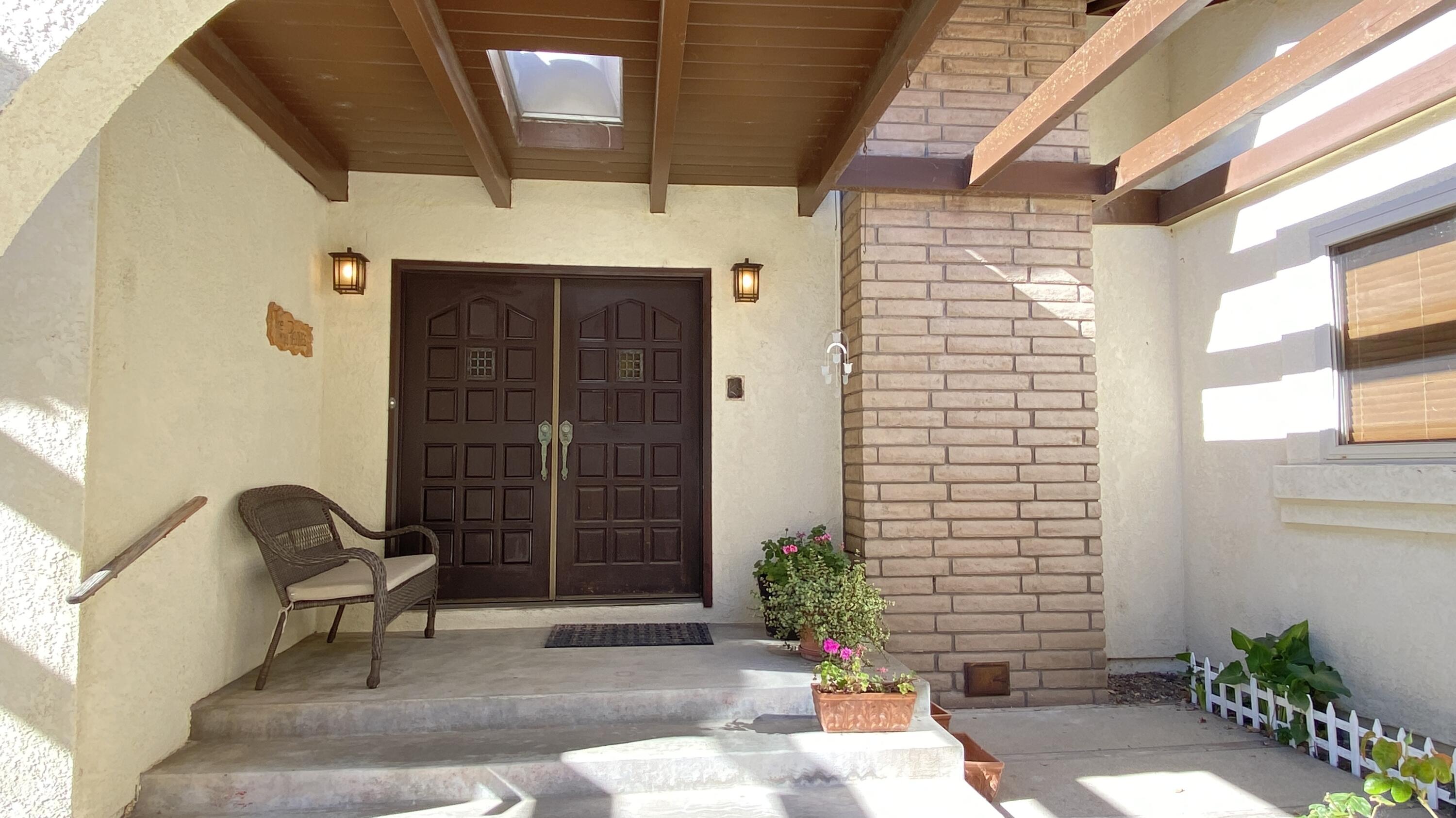 1401 San Miguelito Road Lompoc, CA 93436 - Photo 13 of 61 a front view of a house with a potted plant