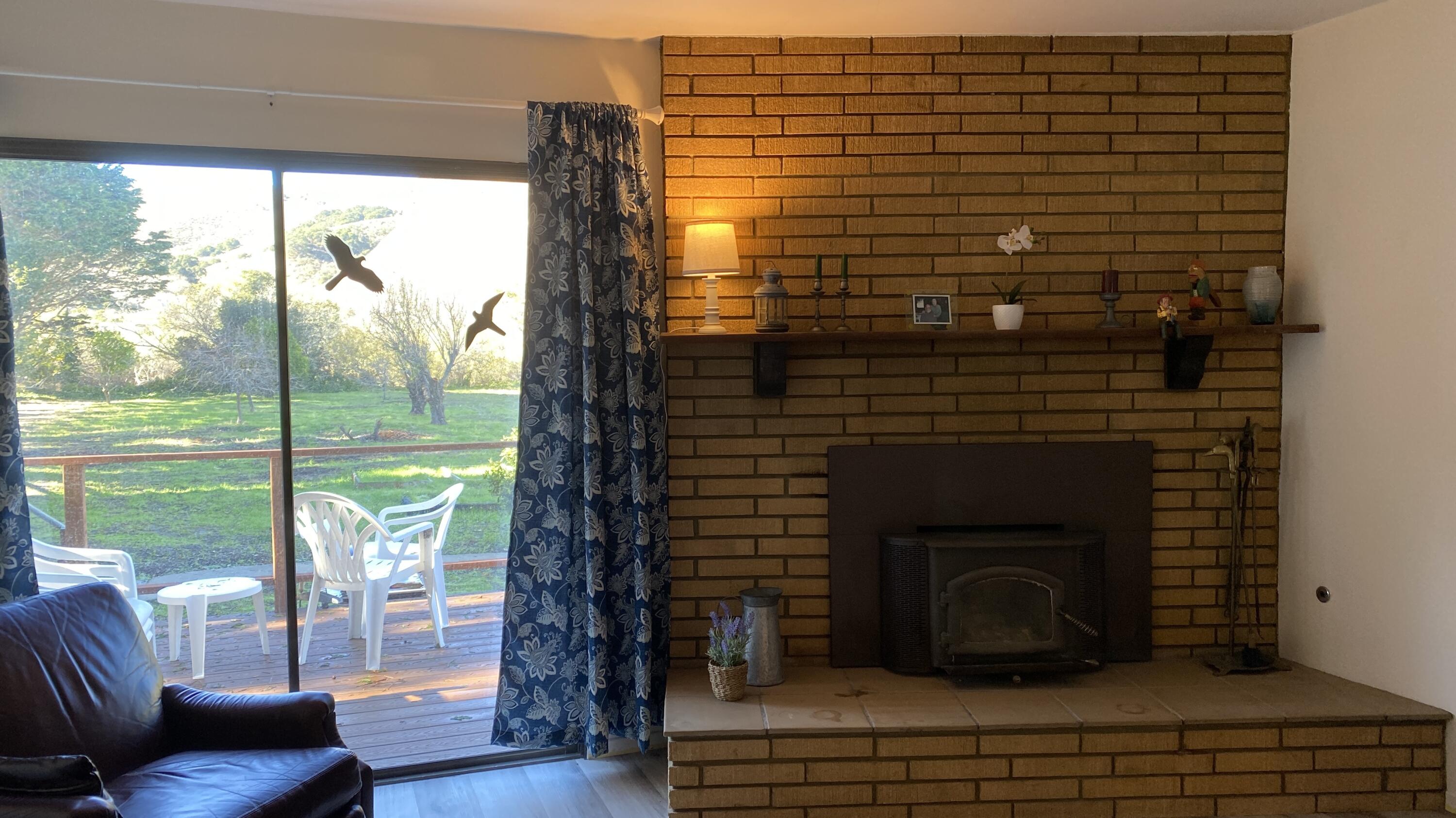 1401 San Miguelito Road Lompoc, CA 93436 - Photo 23 of 61 a living room with a fireplace