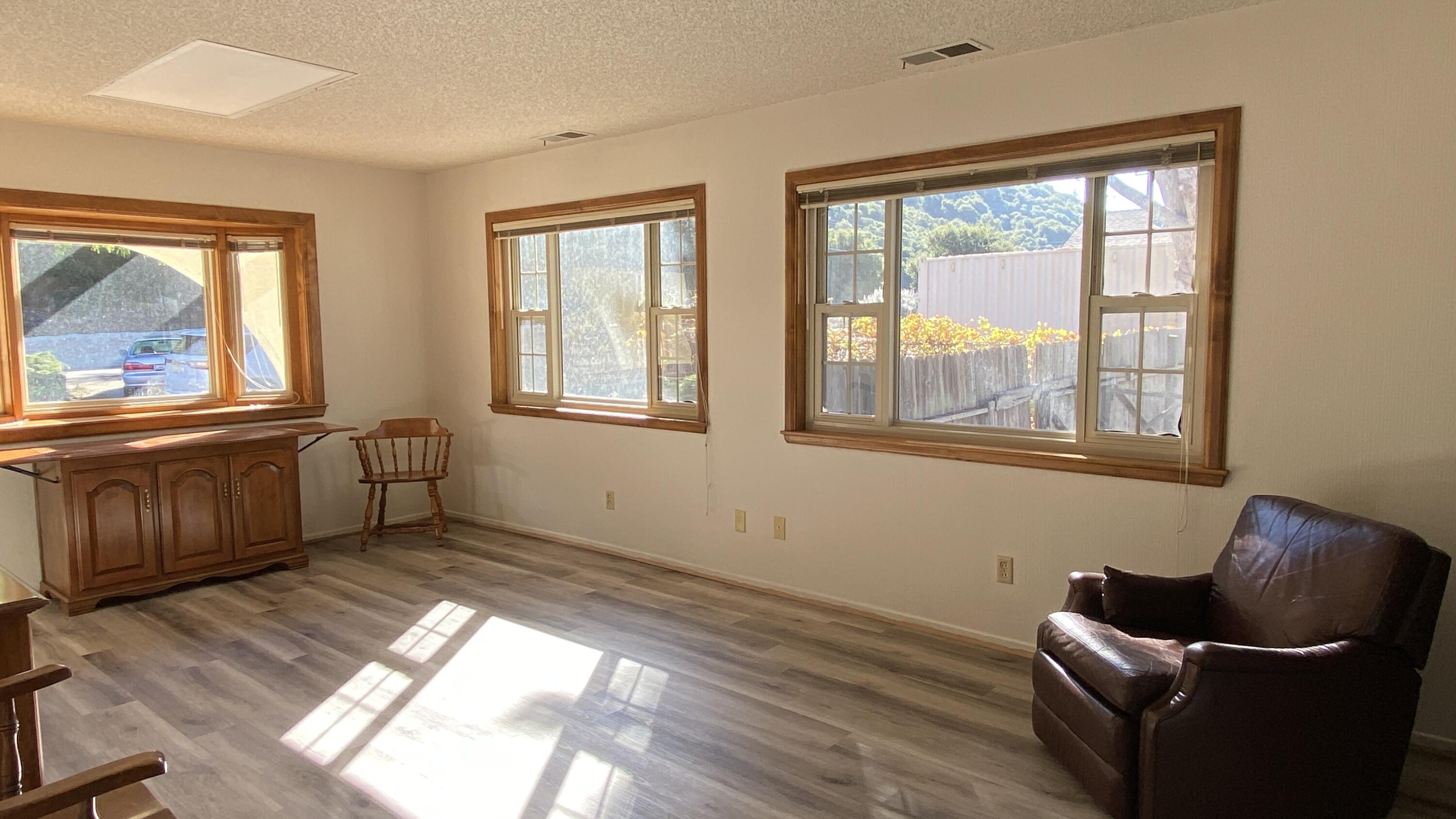 1401 San Miguelito Road Lompoc, CA 93436 - Photo 29 of 61 a view of an empty room with a window and wooden floor