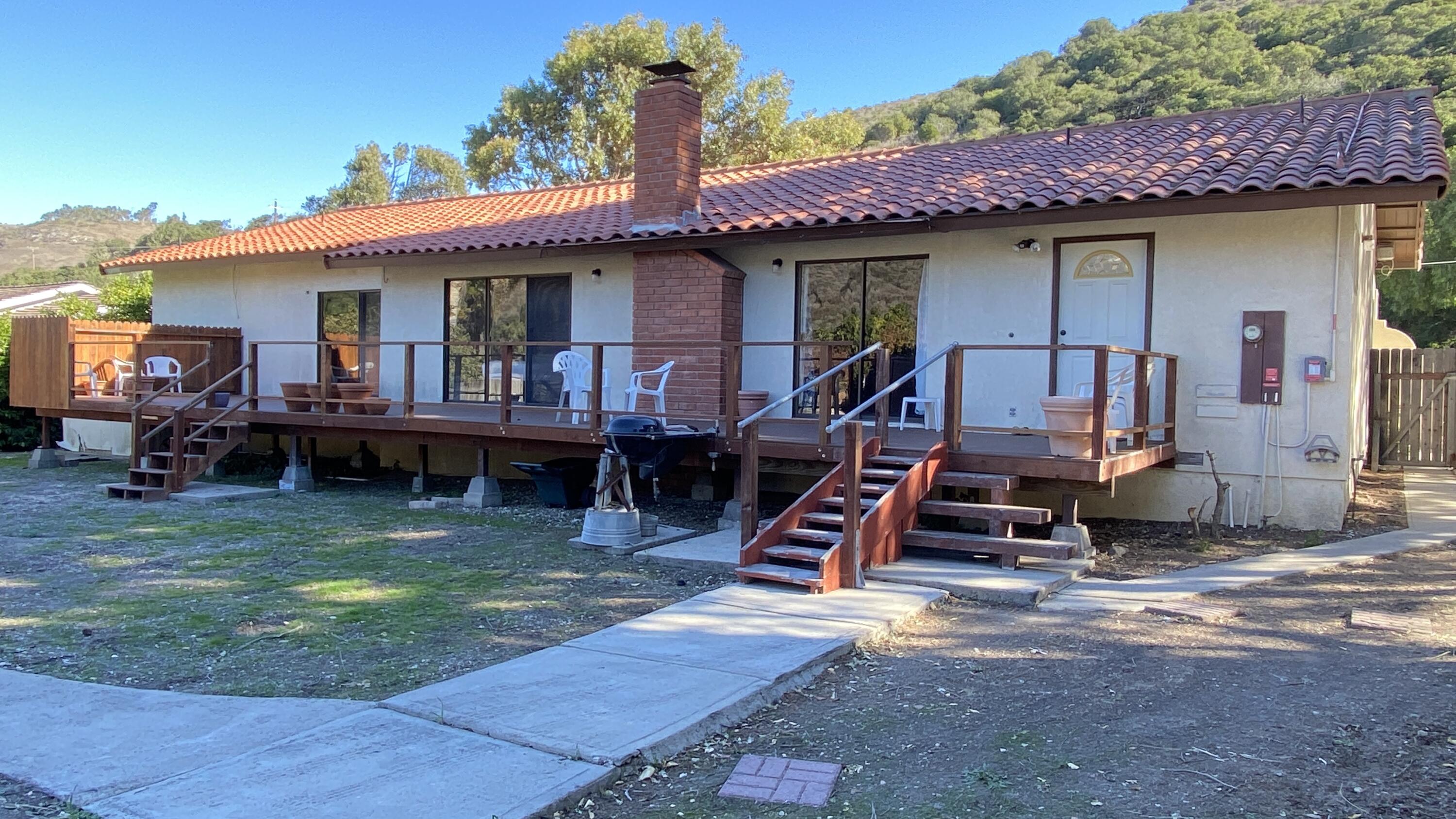 1401 San Miguelito Road Lompoc, CA 93436 - Photo 46 of 61 a view of a house with wooden deck front of house