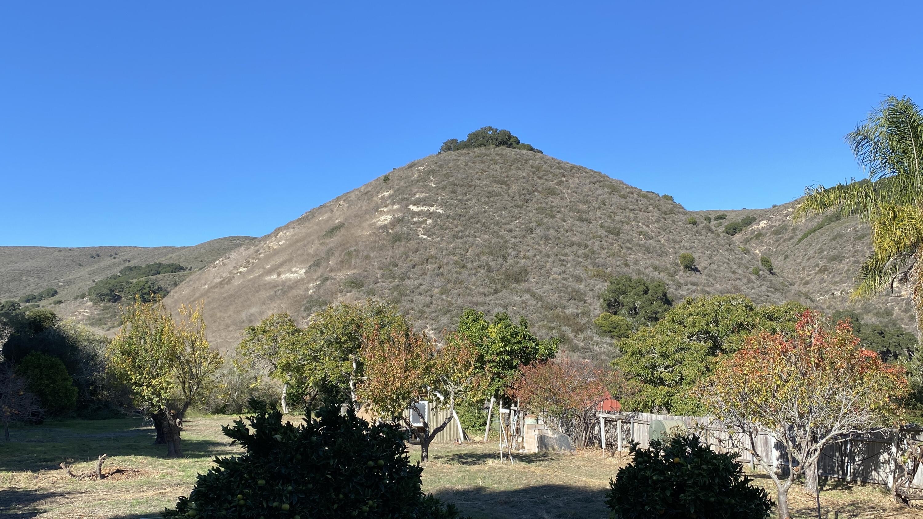 1401 San Miguelito Road Lompoc, CA 93436 - Photo 51 of 61 a view of a large mountain with a mountain in the background