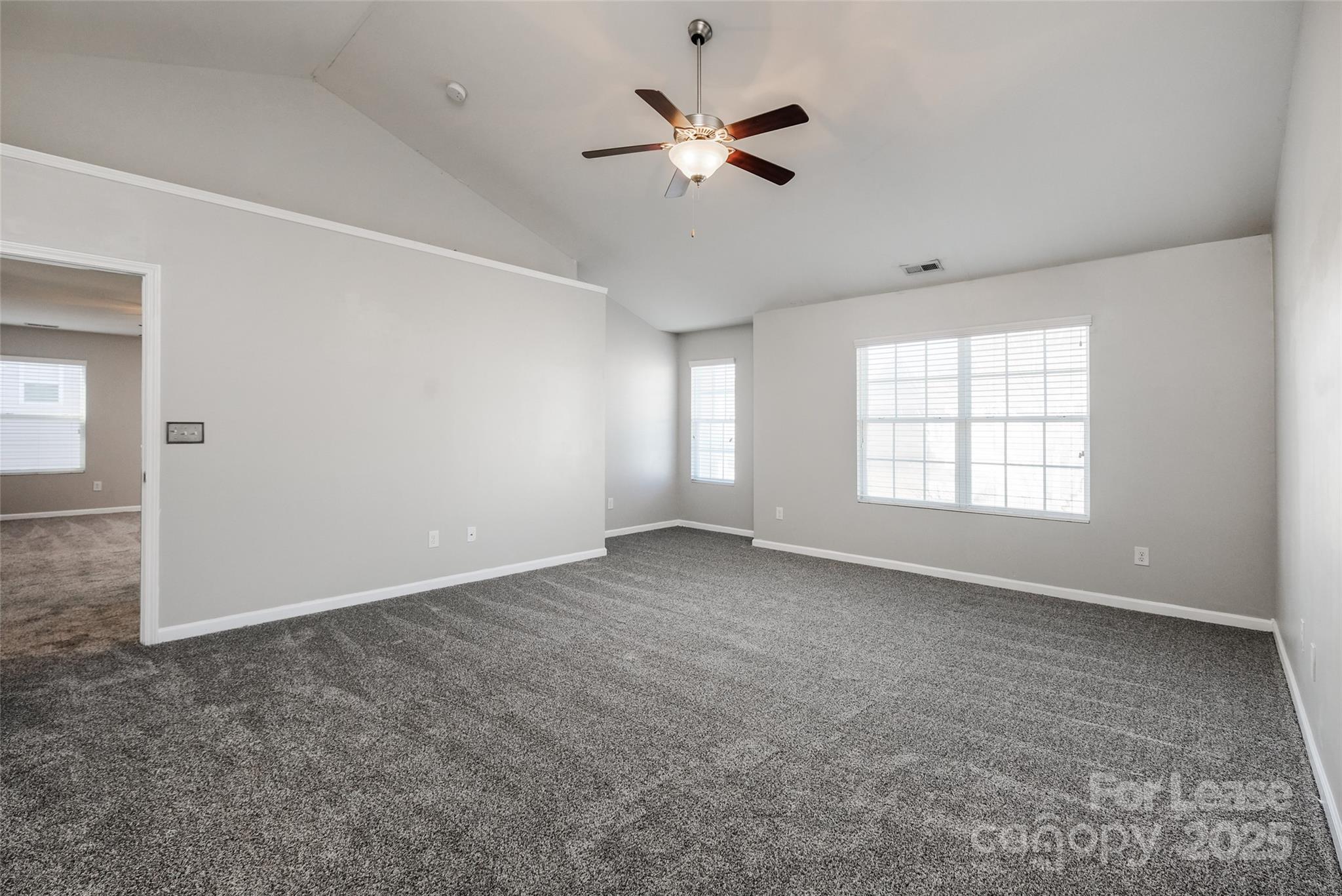13027 Rothe House Road Charlotte, NC 28273 - Photo 18 of 31 wooden floor in an empty room with a window