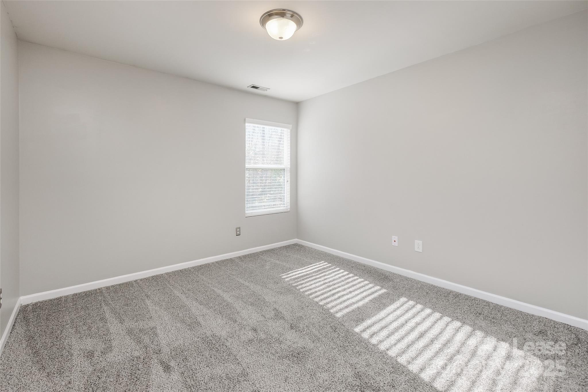 13027 Rothe House Road Charlotte, NC 28273 - Photo 25 of 31 a view of an empty room and window
