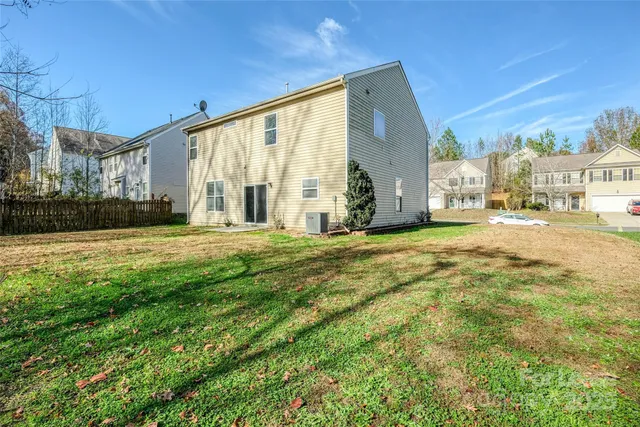 a view of a house with a big yard