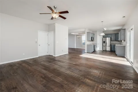a view of a kitchen with a sink and a stove top oven