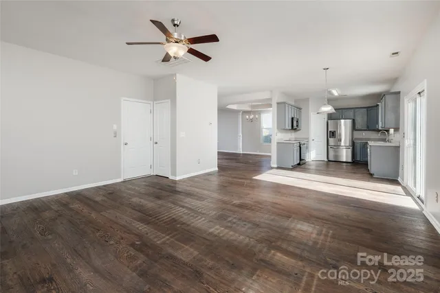 a view of a kitchen with a sink and a stove top oven