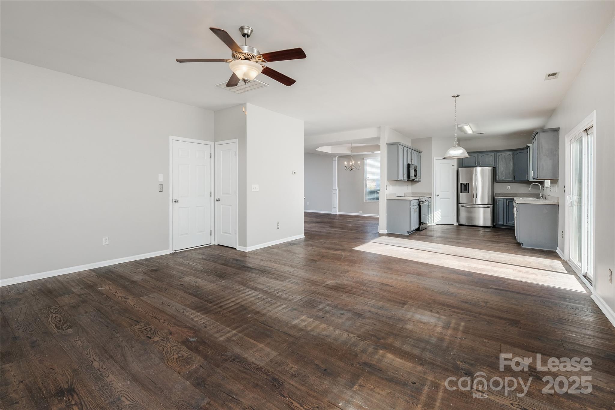 13027 Rothe House Road Charlotte, NC 28273 - Photo 9 of 31 a view of a kitchen with a sink and a stove top oven