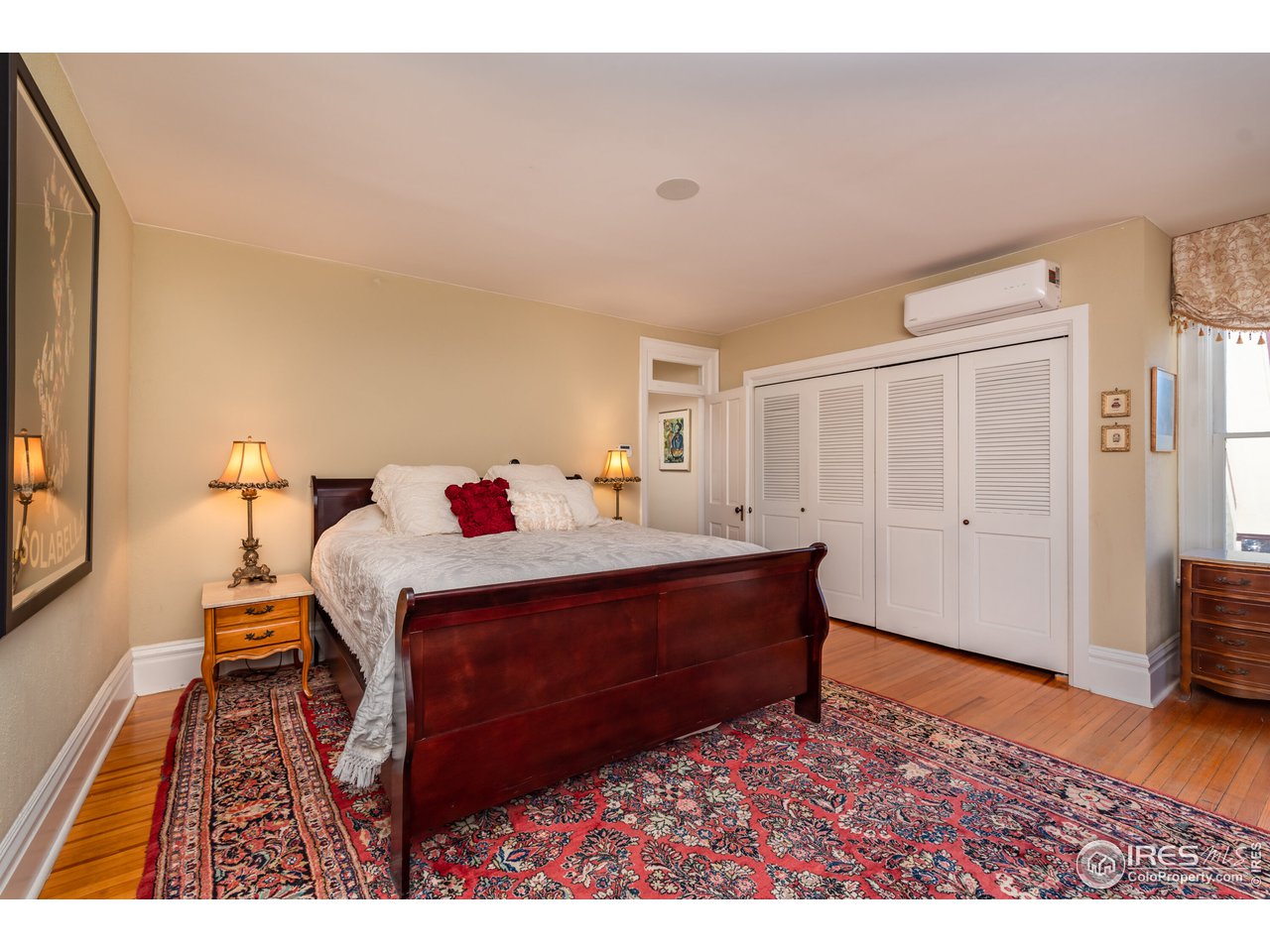 809 Pine Street Boulder, CO 80302 - Photo 15 of 38 a bed room with a bed and a chair