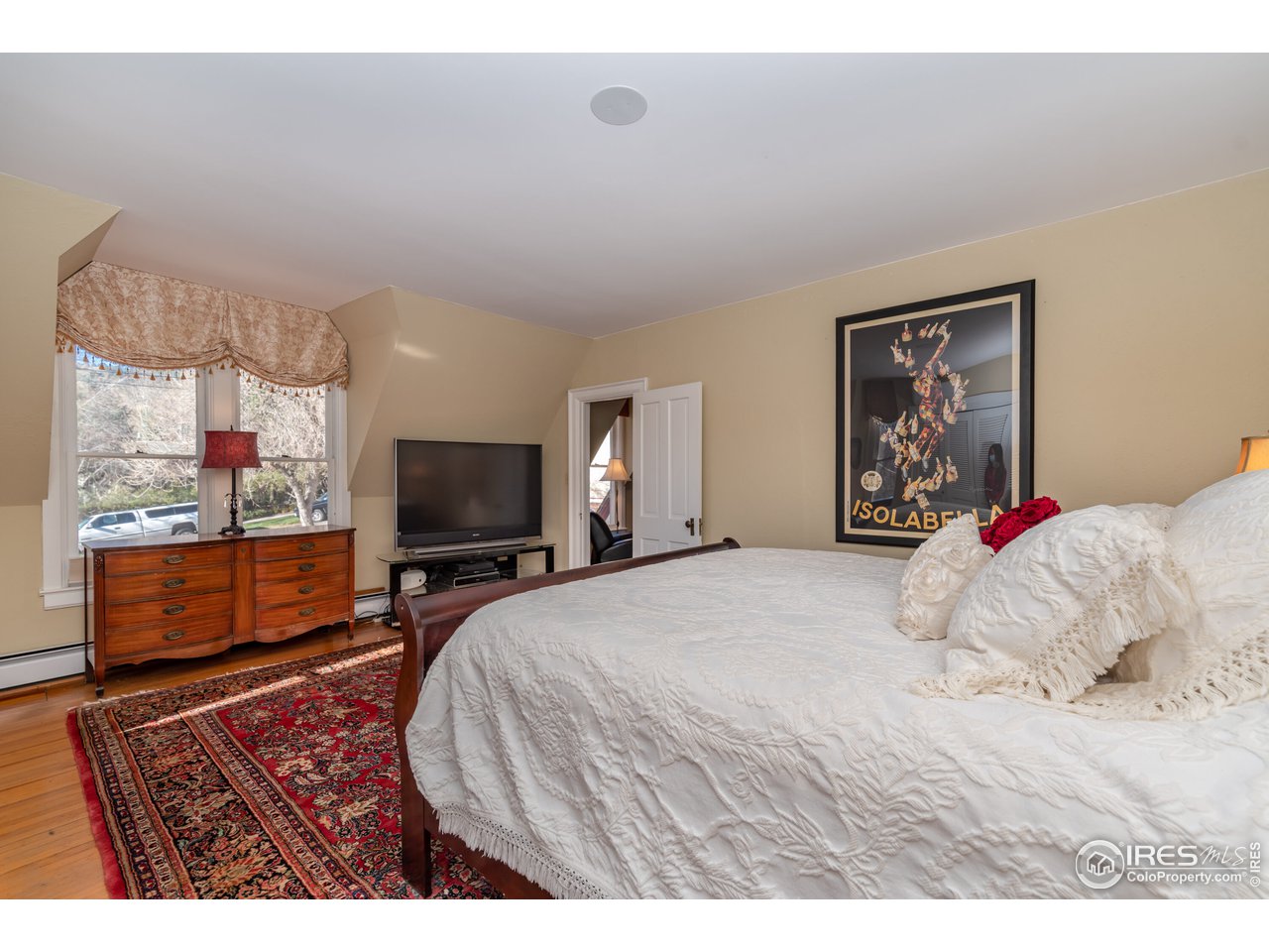 809 Pine Street Boulder, CO 80302 - Photo 16 of 38 a bedroom with a bed and glass window
