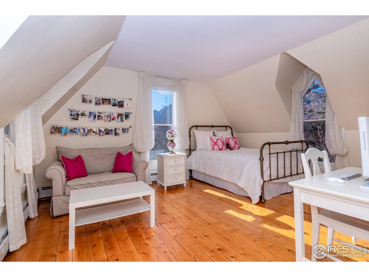 809 Pine Street Boulder, CO 80302 - Photo 18 of 38 a bedroom with a bed and white walls