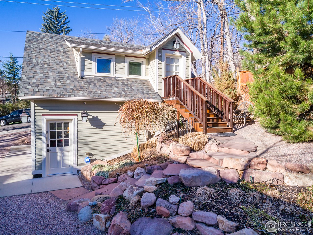 809 Pine Street Boulder, CO 80302 - Photo 21 of 38 a front view of a house with a yard