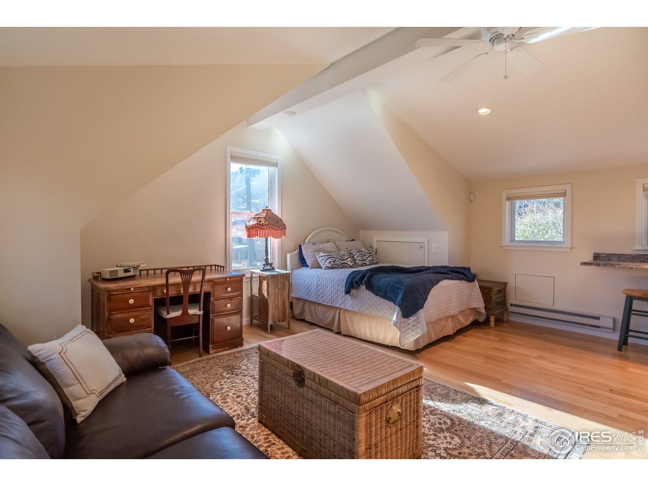 809 Pine Street Boulder, CO 80302 - Photo 22 of 38 a bedroom with furniture and wooden floor