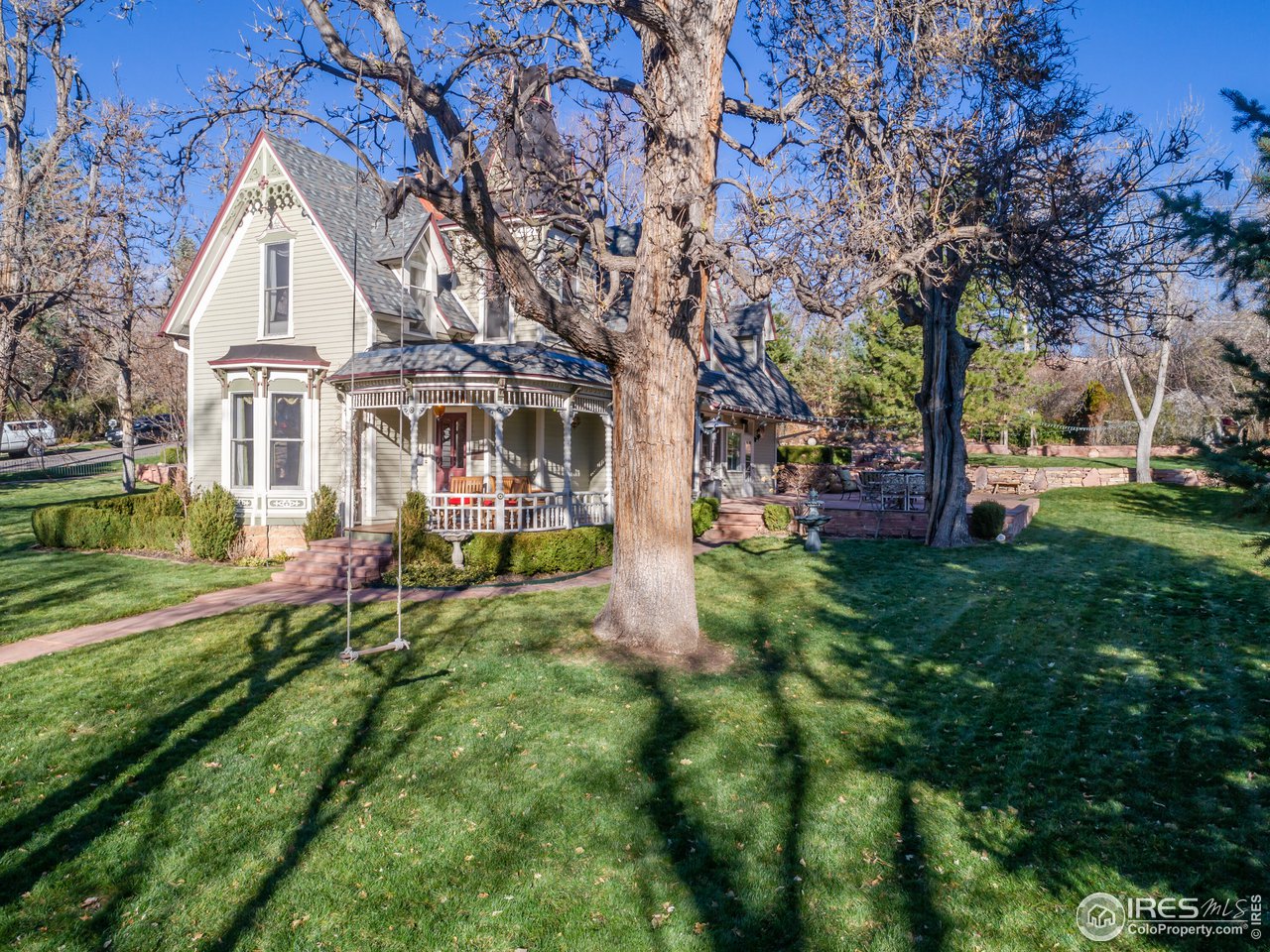 809 Pine Street Boulder, CO 80302 - Photo 23 of 38 a front view of a house with a yard