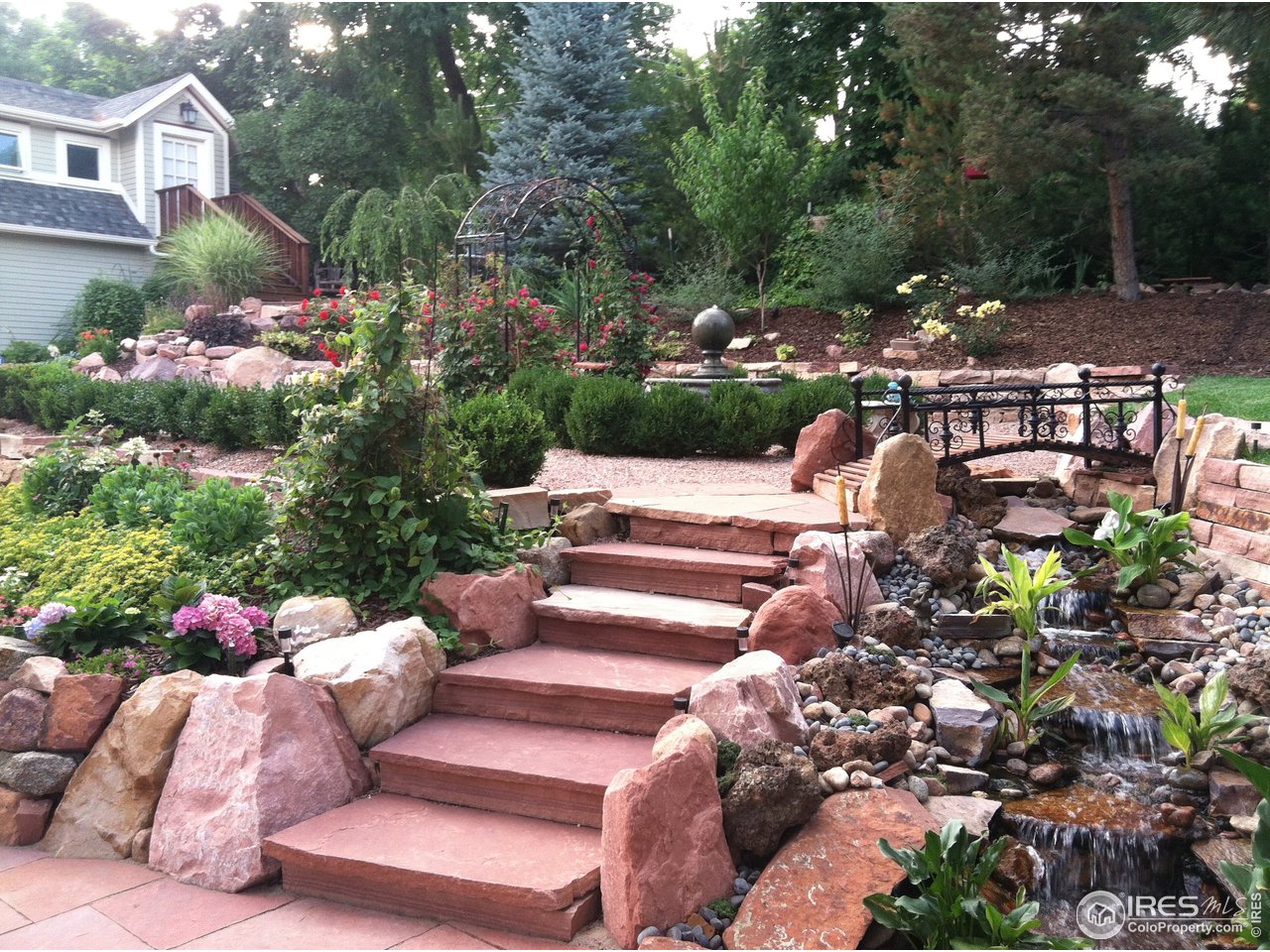 809 Pine Street Boulder, CO 80302 - Photo 32 of 38 a view of a patio with table and chairs potted plants