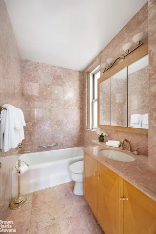 a bedroom with a large bed and a large window