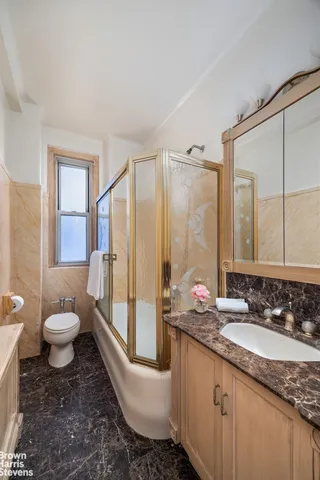 wooden floor chandelier and windows in a room