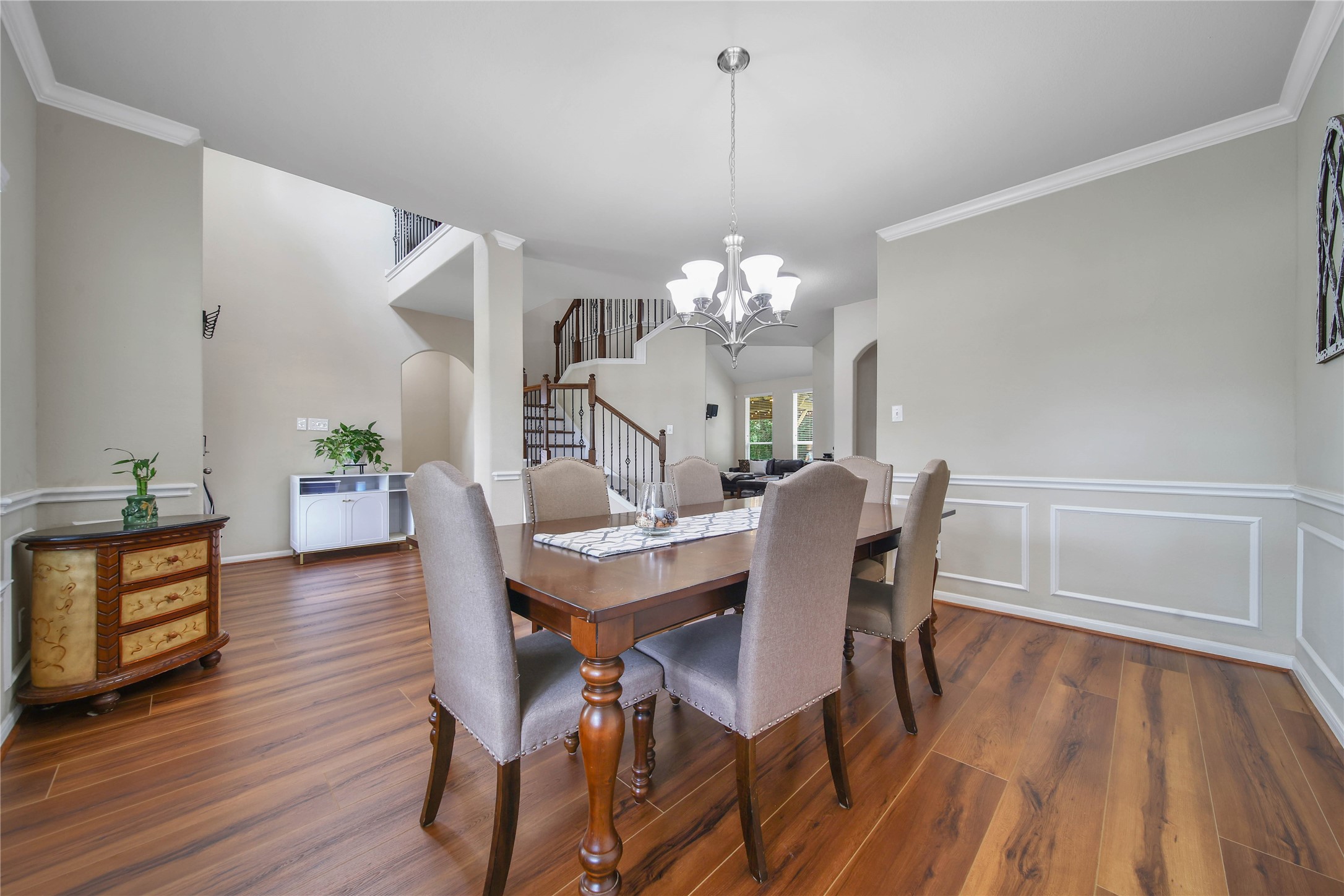 9223 Wapiti Trail Conroe, TX 77303 - Photo 12 of 45 a view of a dining room with furniture and wooden floor