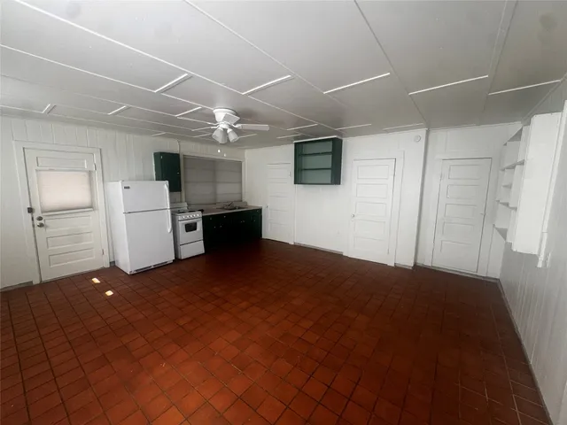 a view of a livingroom with a kitchen