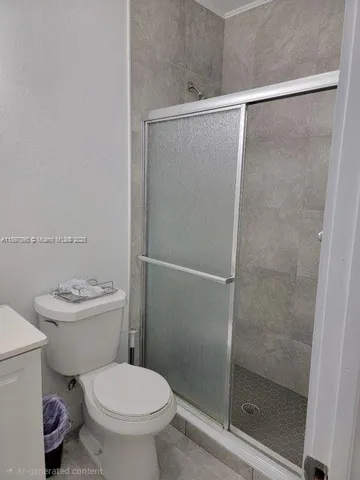 a white toilet sitting next to a bathroom sink